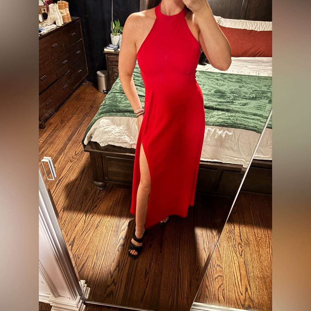 Red, high neck, sleeveless slimming gown with leg slit. NWOT. Never worn!